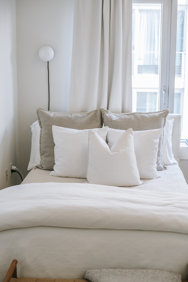 Bedroom with soft blanket and cushions